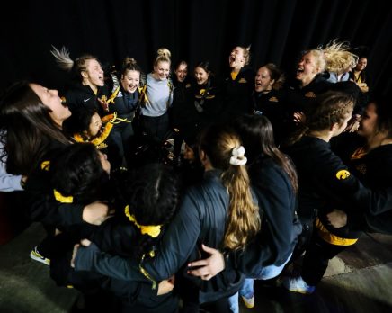 women wrestlers celebrate